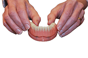 denture in place on dental implant