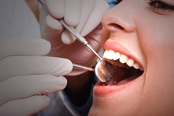 happy woman receiving dental examination